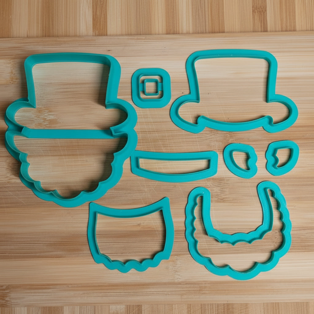 Set of turquoise cookie cutters on a wooden board