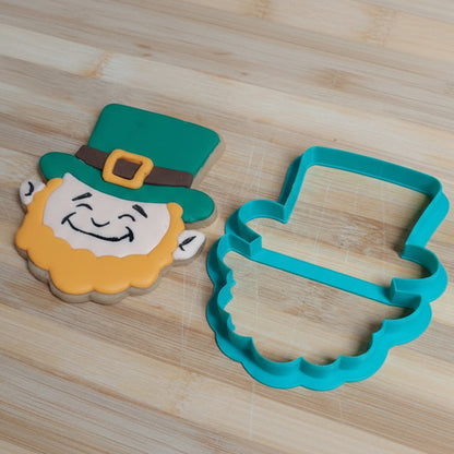 Cookie cutter shaped like a leprechaun with a wooden background